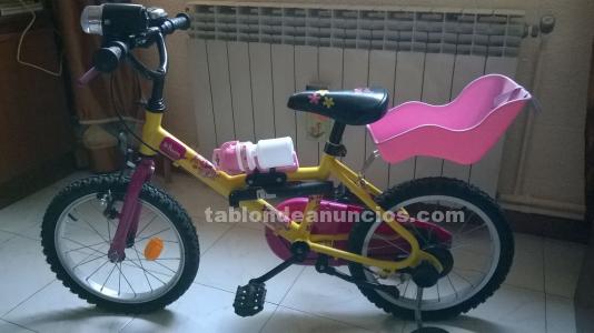 Bici rosa de niña b'Twin con extras.