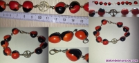 Fotos del anuncio: Pulsera  roja  y  negra  5  €